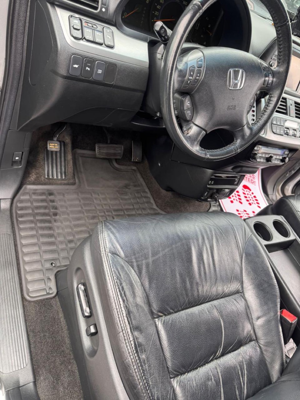 Dusty car pedal and carpet before, and vacuumed clean pedal area after interior detailing — after